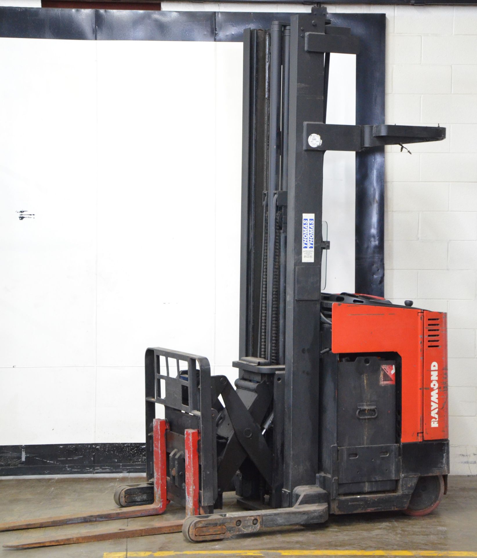 RAYMOND EASI 36V ELECTRIC REACH TRUCK WITH 3,000 LB CAPACITY, 3-STAGE MAST, 270" MAX VERTICAL REACH,