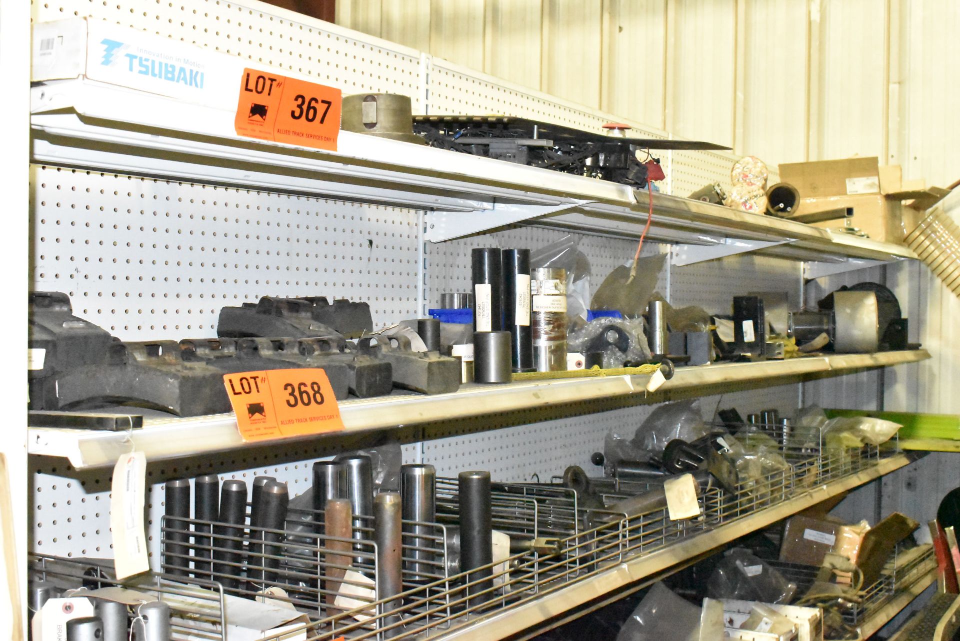 LOT/ CONTENTS OF RACK - TRIPP PARTS, CONTROLS, HYDRAULIC PARTS, CYLINDERS, BITS, BRAKE SHOES,