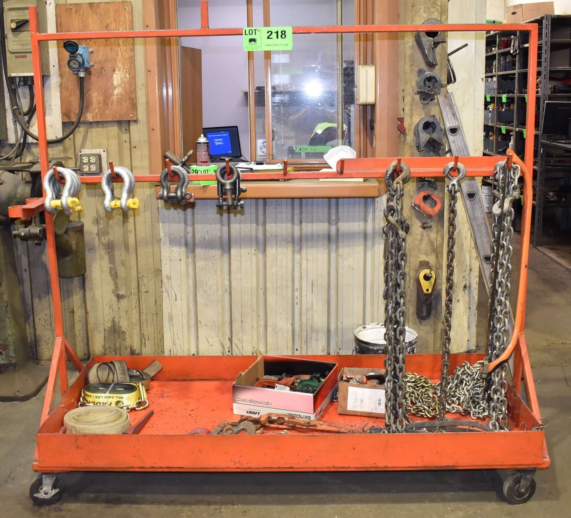 LOT/ ROLLING RACK WITH RIGGING SUPPLIES CONSISTING OF SHACKLES, EYE BOLTS, CHAIN AND STRAPS