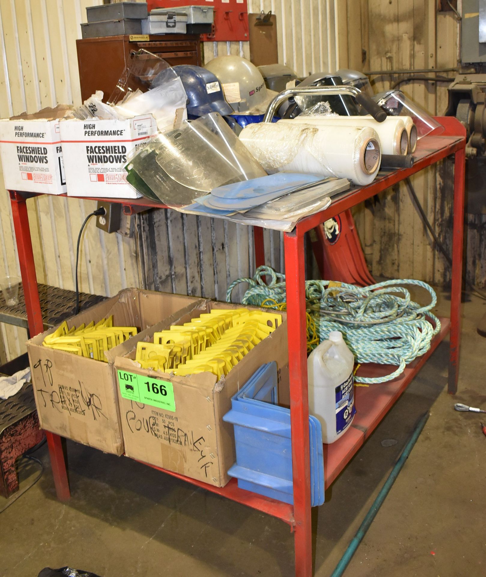 LOT/ TABLE WITH SUPPLIES CONSISTING OF TRAILER STRAP GUARDS, SHRINK WRAP, FACE SHIELD WINDOWS,