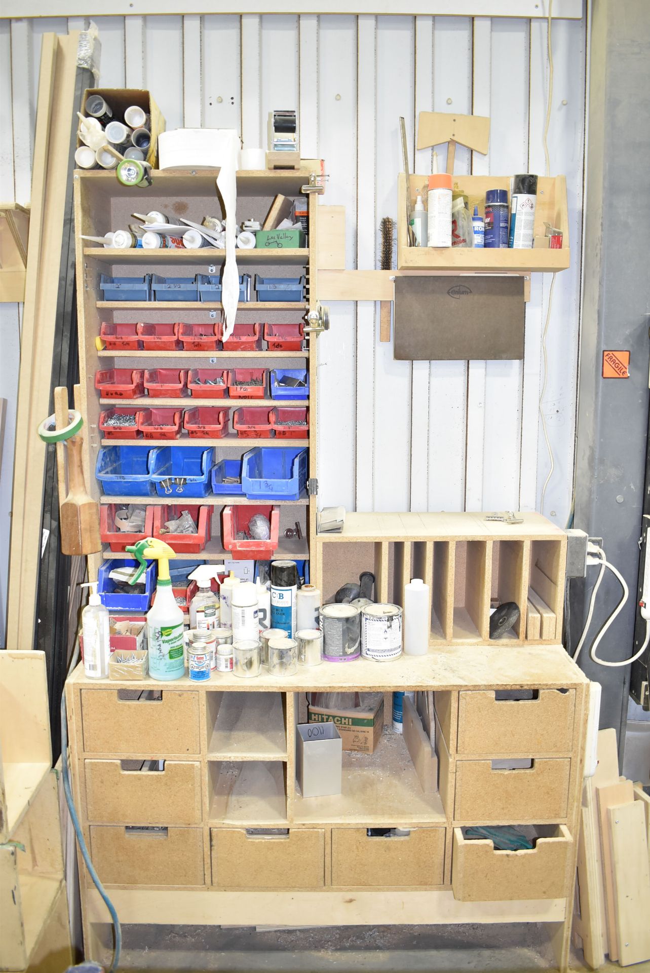 LOT/ CONTENTS ALONG WALL CONSISTING OF WORKBENCHES, TOOLS, HARDWARE, WOOD TRIM AND PANELS [RIGGING - Image 7 of 12
