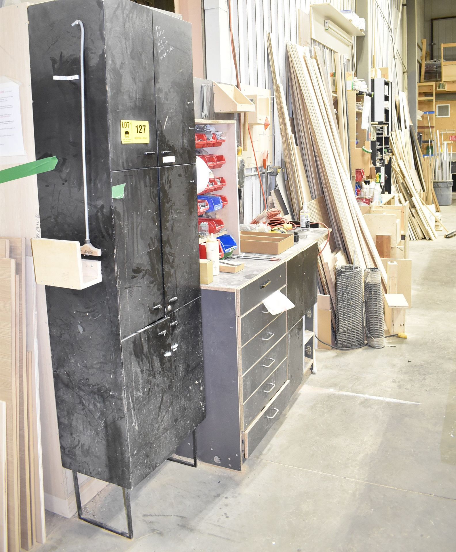 LOT/ CONTENTS ALONG WALL CONSISTING OF WORKBENCHES, TOOLS, HARDWARE, WOOD TRIM AND PANELS [RIGGING