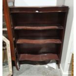 Modern mahogany bookcase with serpentine fronted shelves, 89.5cm x 130cm