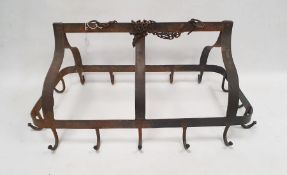Antique wrought iron pot rack, of arched rectangular form, suspended from chains, with sixteen hooks