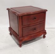 20th century Eastern serpentine-fronted bedside chest of two drawers, on squat cabriole legs