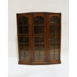 Early 20th century oak display cupboard with breakfront, astragal-glazed doors to the shelves, on