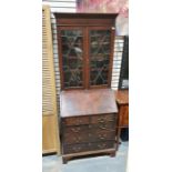 20th century George III-style bureau bookcase, the moulded cornice with Greek key decoration and