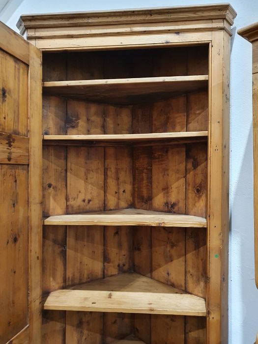 Pine floor-standing corner cupboard with panelled door opening to reveal shelves, on plinth base, - Image 3 of 5