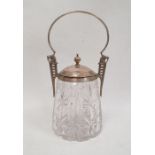 An early 20th century cut glass and silver-plate mounted jar and cover, with silver-plated loop