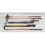 Old ebonised wood and bone walking stick, umbrella and sundry wooden and iron golf clubs