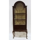 Early 20th century mahogany display cabinet, the dome top with astragal glazed door enclosing
