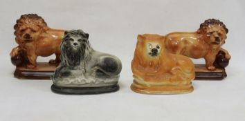 Collection of Staffordshire pottery models of lions, early 20th century, comprising a pair of Hanley