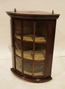 Modern mahogany corner display cabinet, moulded corners, astragal glazed doors enclosing shelves,