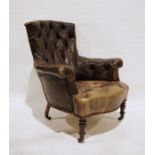 Late 19th century brown leather button-back armchair on turned supports to castors