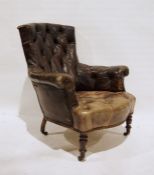 Late 19th century brown leather button-back armchair on turned supports to castors