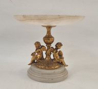 Small marble tazza with gilt cherub supports (chipped) 13cm high, 14.5cm dia. Condition ReportApprox