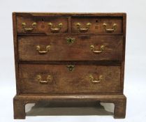 Georgian oak chest, the rectangular top with moulded edge above two short and two long graduated