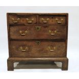 Georgian oak chest, the rectangular top with moulded edge above two short and two long graduated