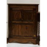 20th century oak corner cupboard by Jaycee with candle slide above panel door, bracket feet, 87cm