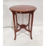 Circular occasional table on square section supports