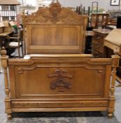 Carved walnutwood small double bed with vase of flowers to the broken arched top headboard