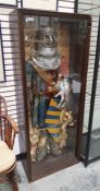Large wax model of an effigy of a knight in armour, with lion at his feet, by G F Roberts, in glazed