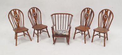 Set of four miniature wooden Windsor wheelback chairs and a stickback miniature rocking chair (5)