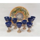 Large Jersey pottery charger with hand painted pear and leaf decoration and a set of studio
