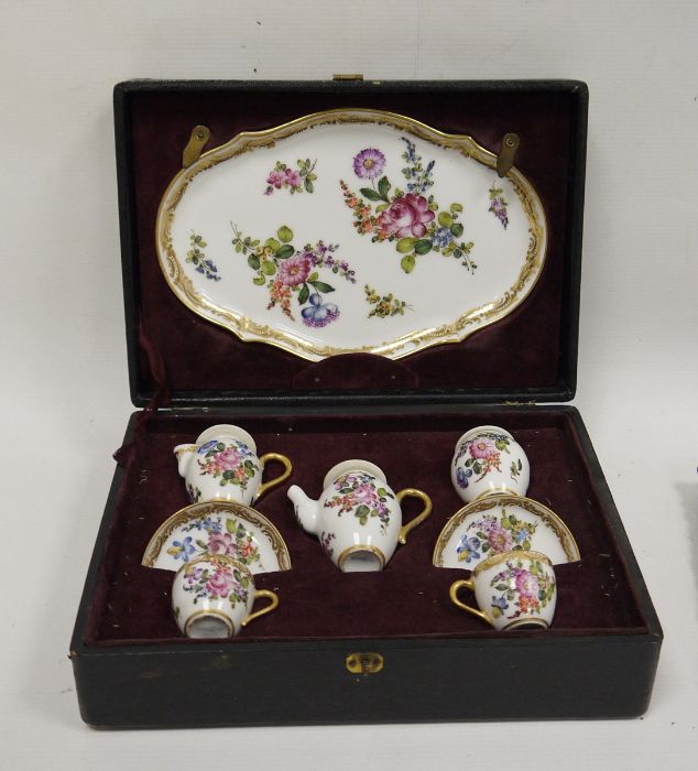 Continental porcelain cased miniature tete-a-tete, late 19th century, printed blue cross swords