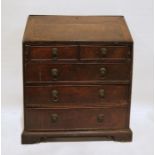 George III oak bureau with fitted interior, above two short and three long graduated drawers, on