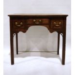 Georgian oak lowboy, the rectangular top above three drawers, on square section supports, 84cm x