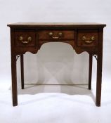 Georgian oak lowboy, the rectangular top above three drawers, on square section supports, 84cm x