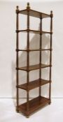 20th century mahogany six-shelf bookcase, the shelves united by turned fluted supports, moulded