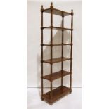 20th century mahogany six-shelf bookcase, the shelves united by turned fluted supports, moulded