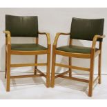 Two utility-type oak-framed carver chairs with vinyl seats and backs (2)