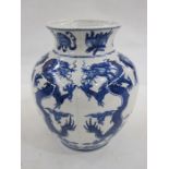 Modern Chinese vase, ovoid and slightly lobed, allover dragon decorated in underglaze blue, 23cm