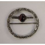 Georgian cut steel buckle of circular form, 8cm diameter and a marcasite bar brooch set with central