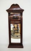 Victorian mahogany mirror with swan-neck pediment, flame mahogany veneer finish, on turned and