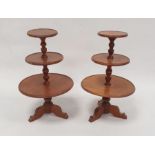Pair of miniature wooden dumbwaiters, each having three circular graduated tiers and on tripod base,