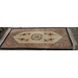 Chinese ivory ground rug with large central medallion and floral decoration with multiple floral