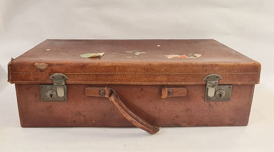 Vintage leather suitcase with some torn travel labels and another, smaller (2)