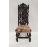 20th century Charles I-style chair, the heavily carved and pierced back and upholstered seat, on