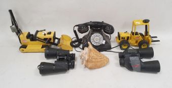 Two yellow metal Tonka toys, two pairs of binoculars, large shell and a reproduction telephone (6)