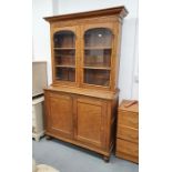 19th/early 20th century oak library bookcase with ogee cornice over round arch glazed doors, on