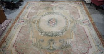 Large Aubusson style cream ground carpet with central floral motif surrounded by floral decoration