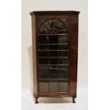 Late 19th/early 20th century mahogany corner display cabinet with astragal-glazed door, raised on