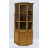 Vintage pine corner cupboard with single glazed door above cupboard door, on plinth base Approx.