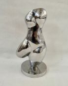 Contemporary freeform sculpture in silvered metal of a female torso