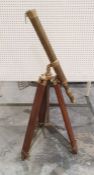 Reproduction brass telescope on a mahogany tripod stand