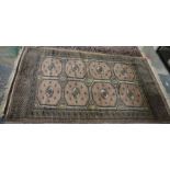 Eastern mushroom ground rug with two rows of four elephant foot guls and geometric borders 222 x 127